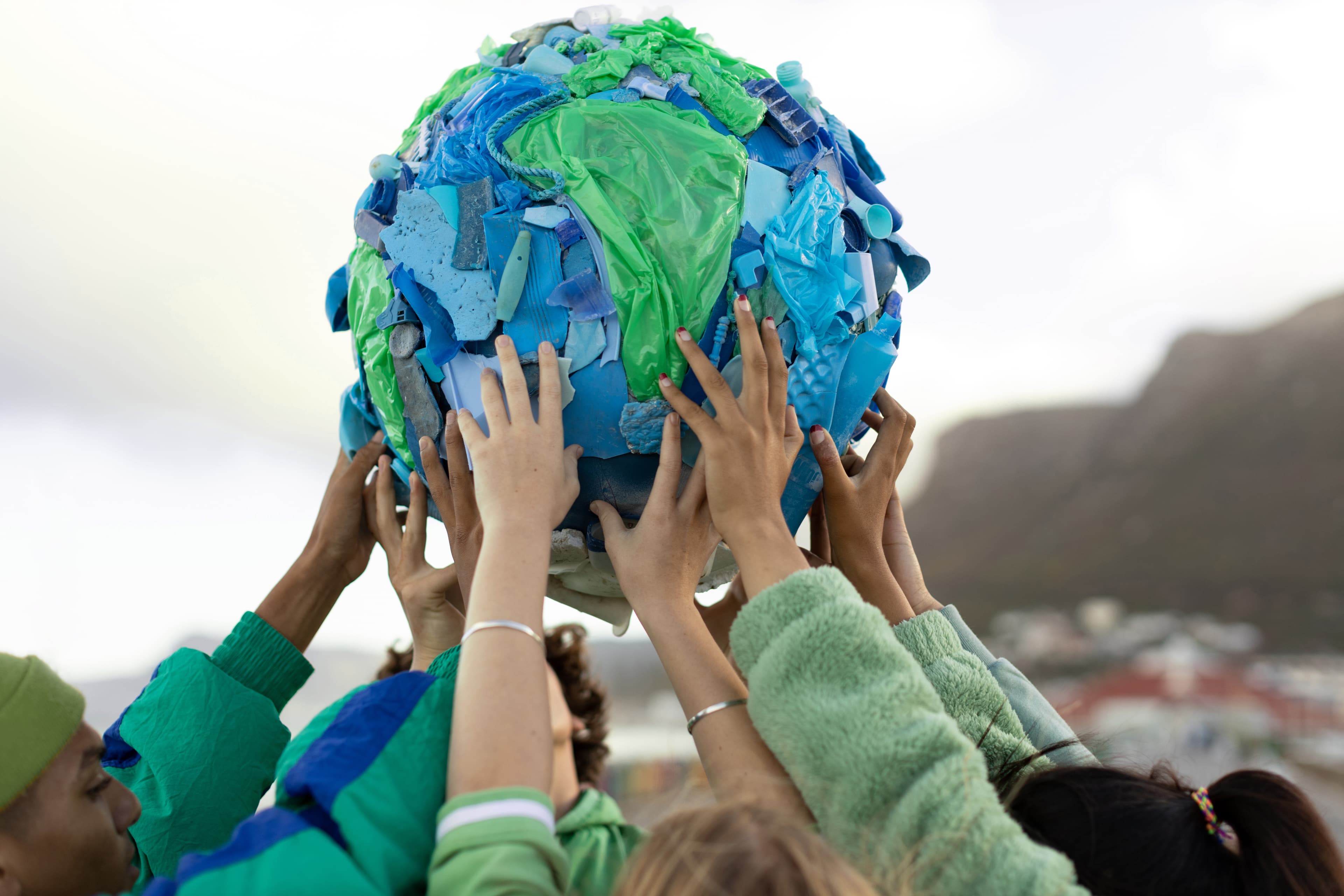 People holding a globe